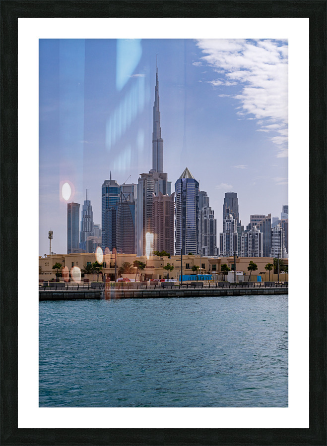 Low rise homes in front of modern apartments of Dubai Downtown d Picture Frame print