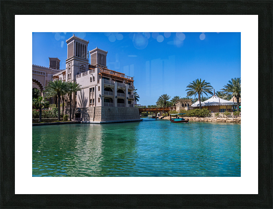 Wooden bridge over waterway in Souk Madinat Junction mall Picture Frame print