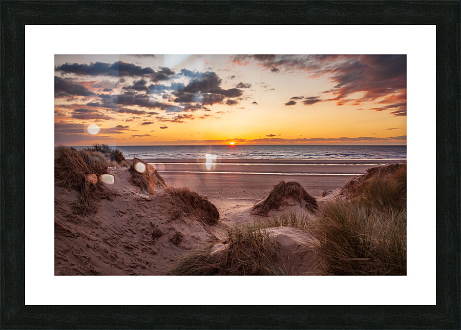 Sunset over Formby Beach through sand dunes  Framed Print Print