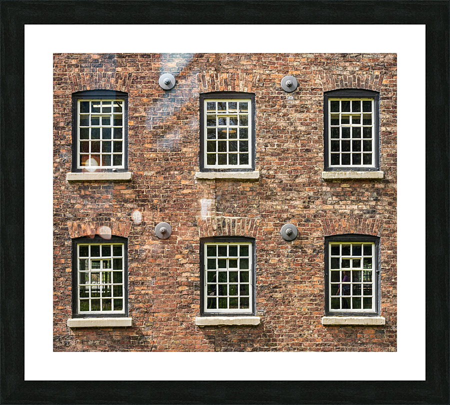 Restored industrial cotton mill with pattern of windows Picture Frame print
