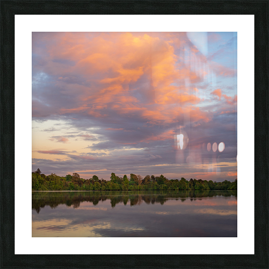 View across the Ellesmere Mere to a clear reflection of distant   Framed Print Print