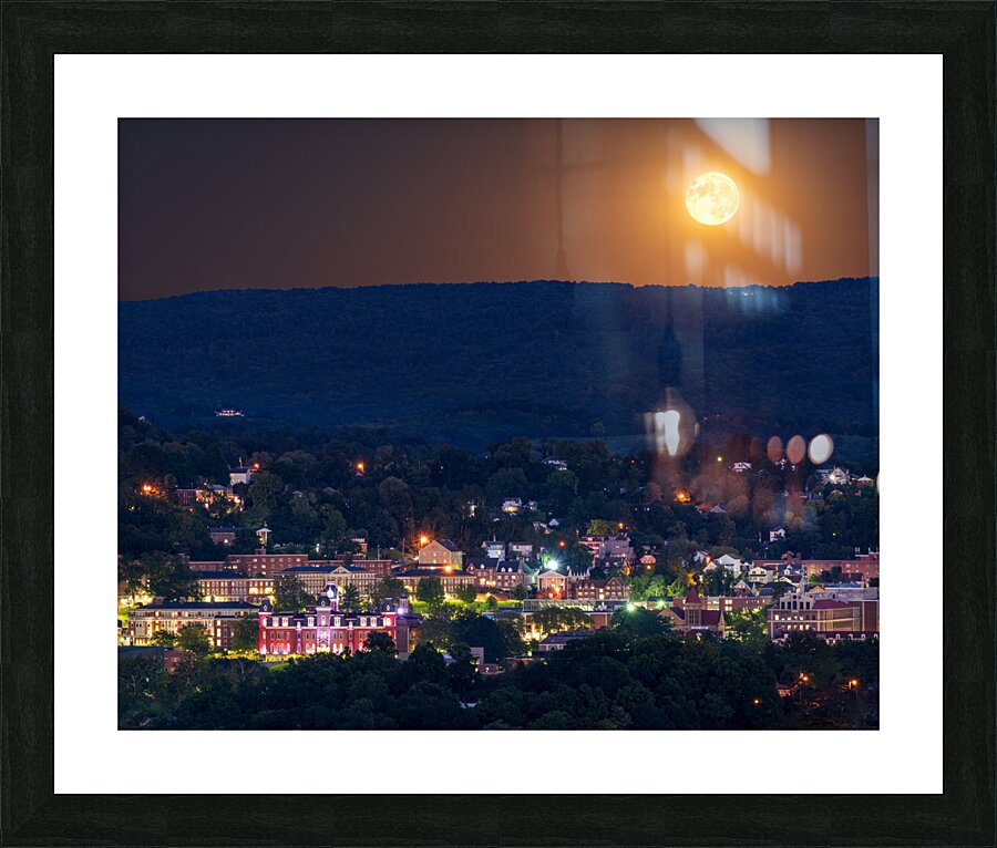 Supermoon rises in the sky above Morgantown in West Virginia Picture Frame print
