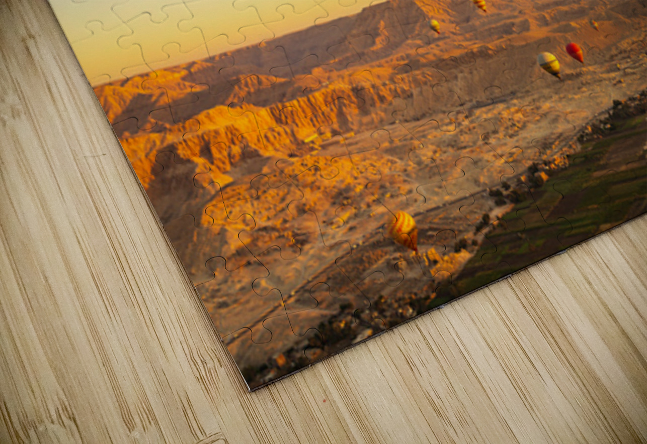 Hot air balloons in sunrise flight over Valley of the Kings in L Steve Heap Puzzle