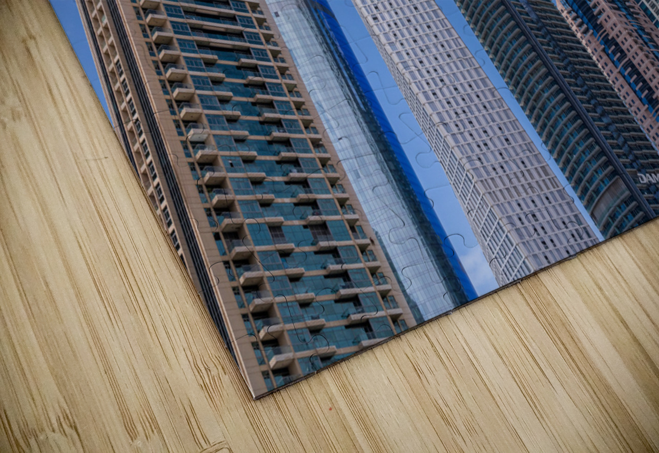 Cayan Tower among tall buildings on waterfront at Dubai Marina Steve Heap Puzzle