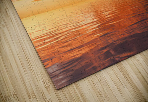 Dramatic sunset reflected in the smooth ripples of a lake or oce Steve Heap puzzle
