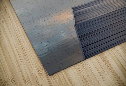 View across the Ellesmere Mere to a clear reflection of distant  Steve Heap puzzle