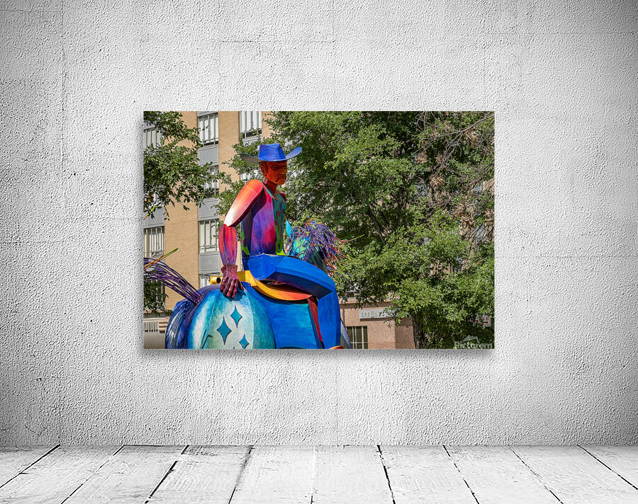 Tracking the end of the rainbow scuplture of cowboy on horse in  Wall Preview