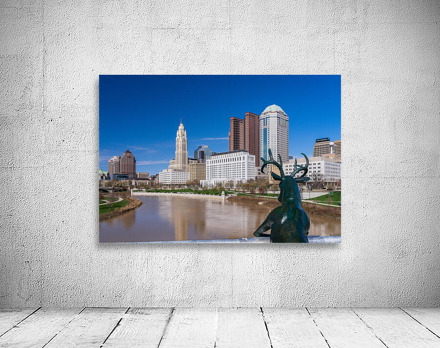 Scioto Lounge statue by waterfront looking at Columbus skyline Wall Preview