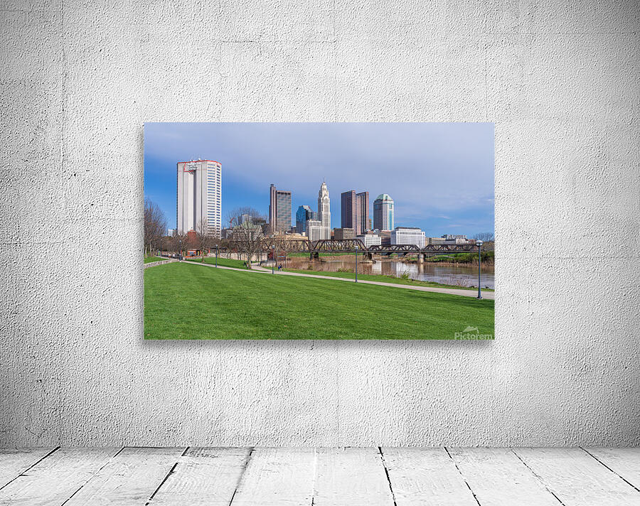 Columbus Ohio waterfront skyline behind railroad truss bridge Wall Preview