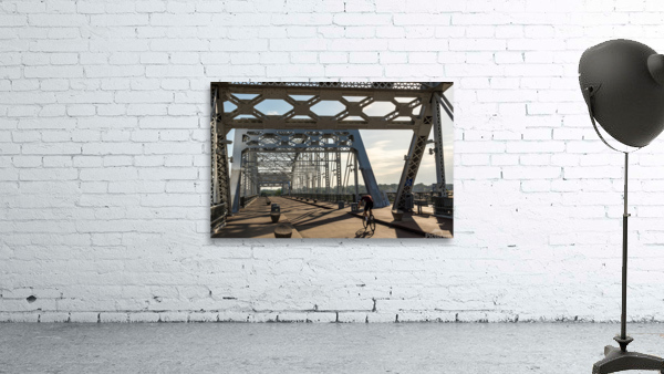 Cyclist on John Seigenthaler pedestrian bridge or Shelby street crossing Wall Preview