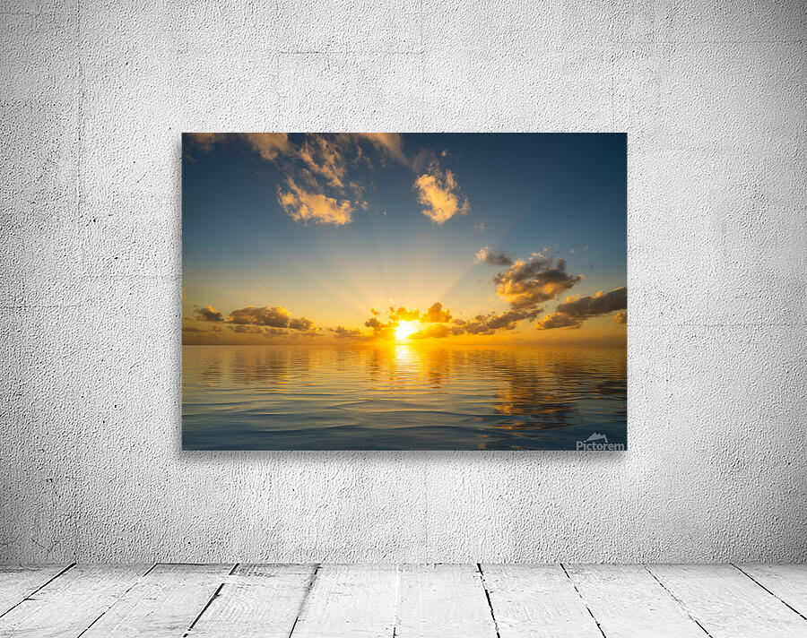 Beautiful sunset reflected in a calm peaceful ocean Wall Preview