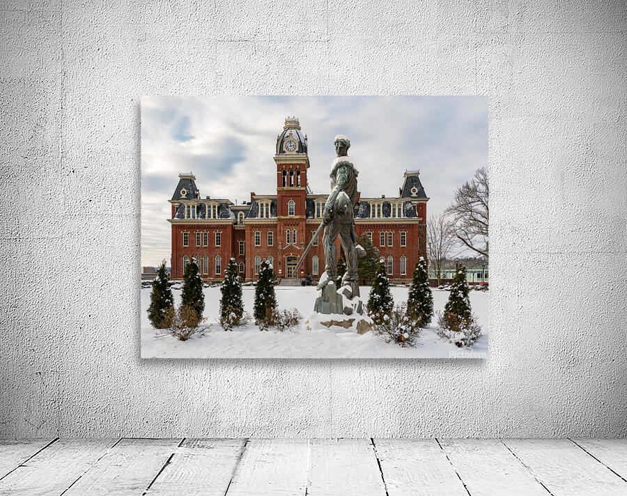 Mountaineer statue against Woodburn Hall Wall Preview