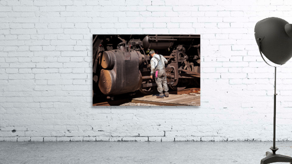 Mechanic checks 1916 Baldwin locomotive Wall Preview