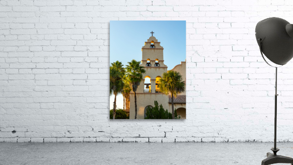 Spanish mission style church tower at sunset Wall Preview