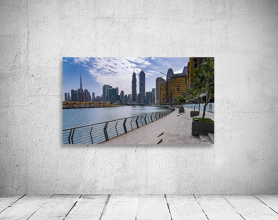 Low rise homes in front of modern apartments of Dubai Downtown d Wall Preview