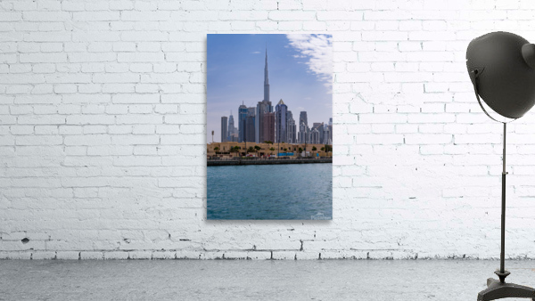 Low rise homes in front of modern apartments of Dubai Downtown d Wall Preview