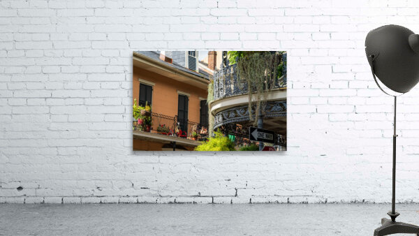 Traditional wrought iron balcony on brick New Orleans house Wall Preview