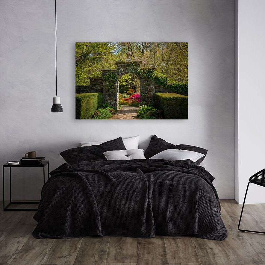 Archway frames Azaleas and Rhododendron trees in spring Reproduction