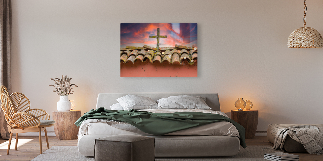 Wooden cross against brilliant sunrise at mission in California Reproduction