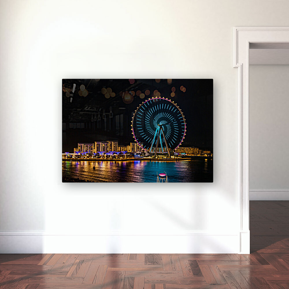 Light show on Ain Dubai observation wheel at sunset Reproduction