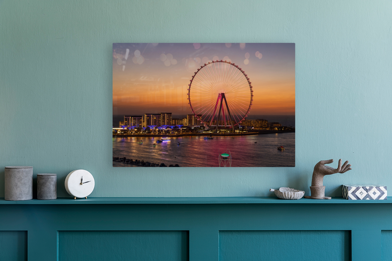 Light show on Ain Dubai observation wheel at sunset Reproduction