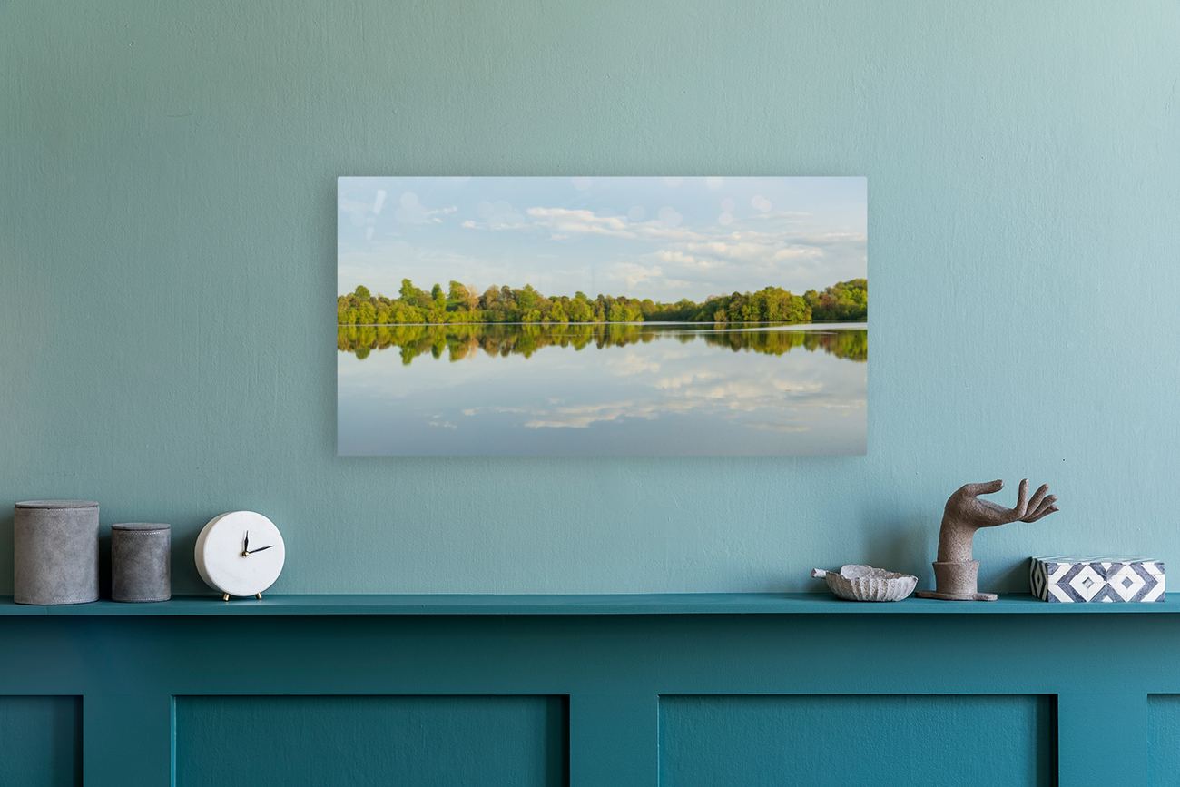 View across the Mere to a clear reflection of distant trees in E Reproduction