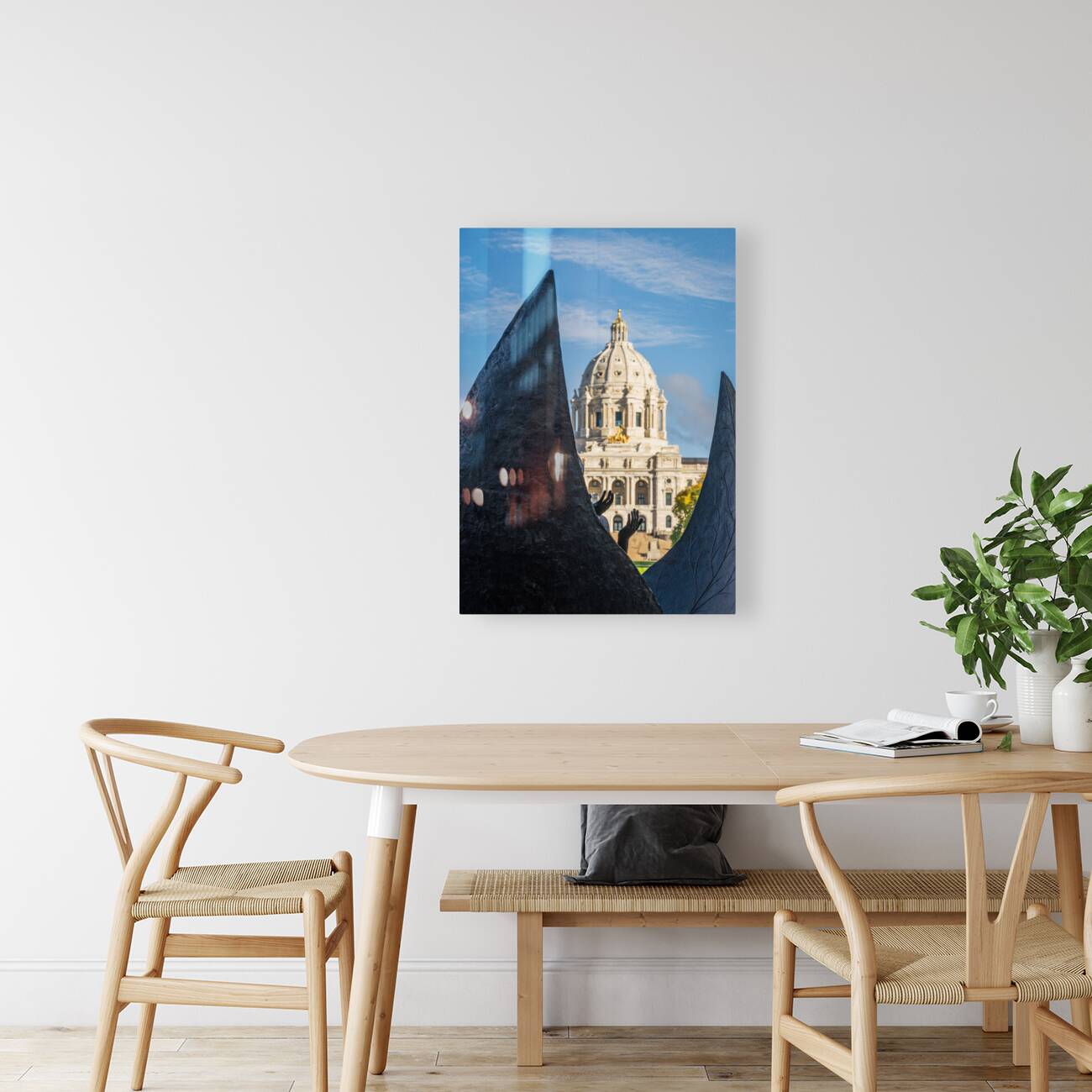 Facade of the State Capitol building in St Paul behind hands Reproduction