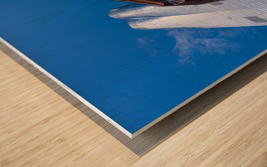 Reflective surface of the Vessel with a skyscraper behind with c Wood print